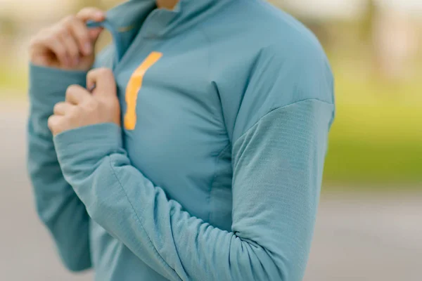 Zip jacket. Sports Olympic blue. Woman in uniform.