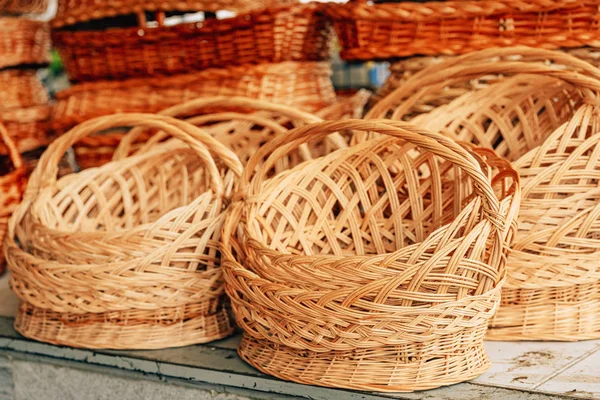 Wicker baskets of vines. A walk through a market in Tashkent. Wicker product for storage.