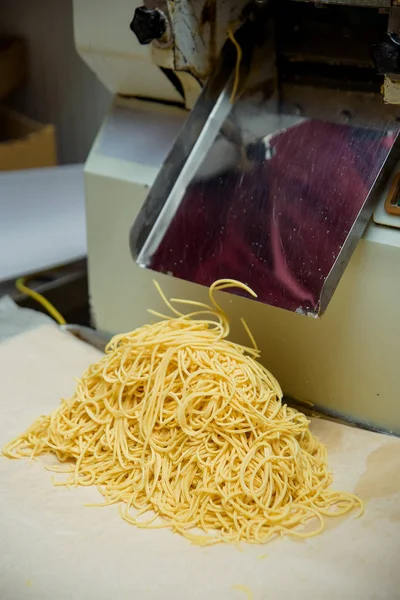 Apparatus for slicing the dough. Cooking dessert chak-chak at the candy factory. Sweet dessert of dough.