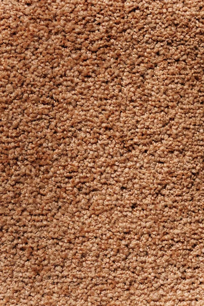 Texture of brown carpet. Old Kovrolan. Soft fabric flooring. Carpet yellow