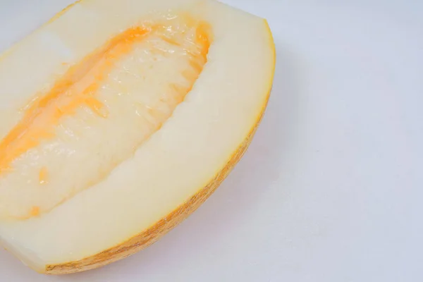 Yellow melon on a white background. Fresh melon on a light background. Kazakhstan melon