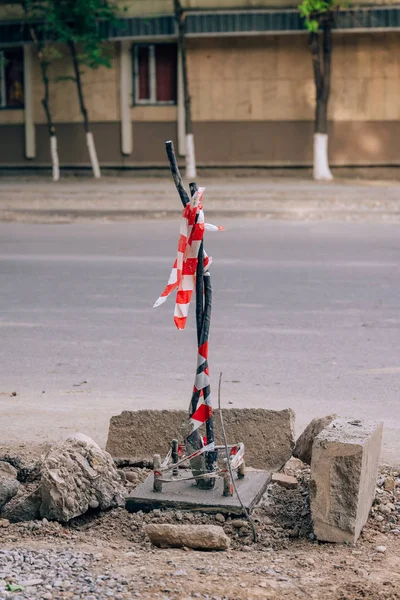 Repair of road lighting in Kazakhstan. Bare wires for lampposts in Shymkent. High voltage wires on the street.