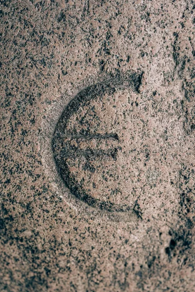 Euro sign carved on the stone. Currency symbol on granite. Stone engraving