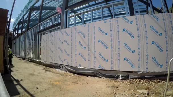 Taping and jointing the jumbo stud drywall at construction site of recycle centre timelapse — Stock Video