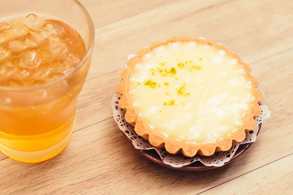 One single lemon tart, isolated on white.