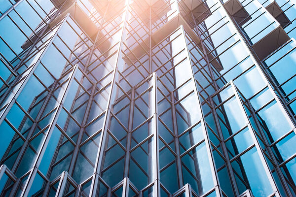 underside panoramic and perspective view to steel blue glass high rise building skyscrapers, business concept of successful industrial architecture