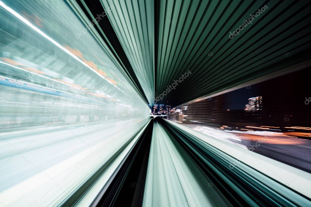 Motion blur of train moving inside tunnel with daylight in tokyo, Japan.