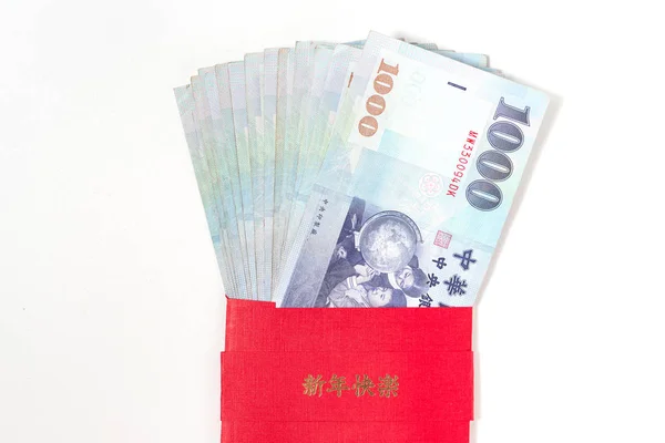 Red envelope packet with Taiwan money on white background for