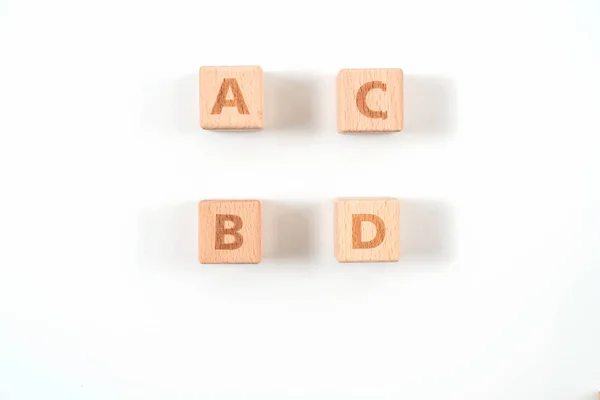 Alfabeto sobre madera, fondo blanco — Foto de Stock