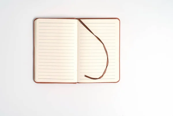 Top view blank orange leather diary on white desk — Stock Photo, Image