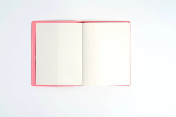 Pink notebook on white desk. Business minimal concept for women. Flat lay, top view, copy space — Stock Photo, Image