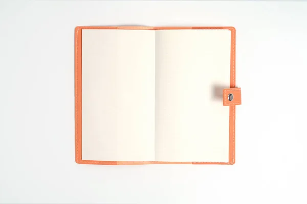 Top view blank orange leather diary on white desk — Stock Photo, Image