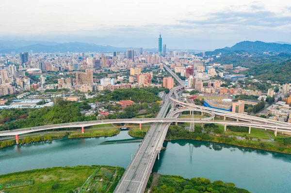 Taipei City Aerial View Asia business concept image, panoramic modern cityscape building birds eye view under sunrise and morning blue bright sky, shot in Taipei, Taiwan