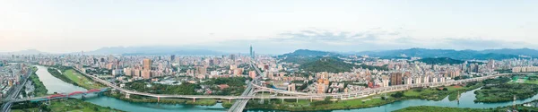 Taipei City Aerial View, Asia business concept image, panoramic modern cityscape building birds eye view under daytime and blue sky, shot in Taipei, Taiwan.