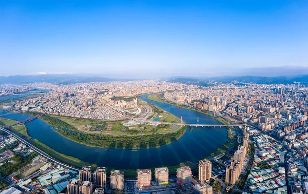 Taipei City Aerial View, Asia business concept image, panoramic modern cityscape building birds eye view under daytime and blue sky, shot in Taipei, Taiwan.