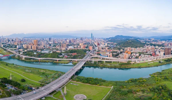 Taipei City Aerial View, Asia business concept image, panoramic modern cityscape building birds eye view under daytime and blue sky, shot in Taipei, Taiwan.