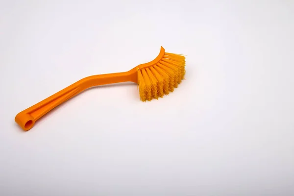 Massage brush on a white background. Orange massage brush. Cosmetics and accessories for bathrooms. Natural bristle massage brush. Prevention of cellulite, skin care — Stock Photo, Image