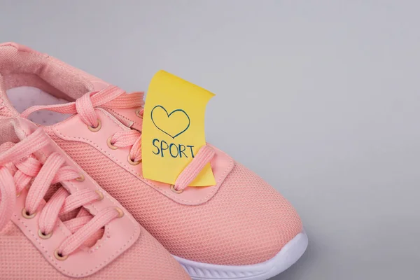 Sport shoes. Fitness concept. Sticker Sport. little note. Healthy habits. run. a sheet of paper on the fridge. Yellow note on the fridge. Reminder. Weight loss and diet.