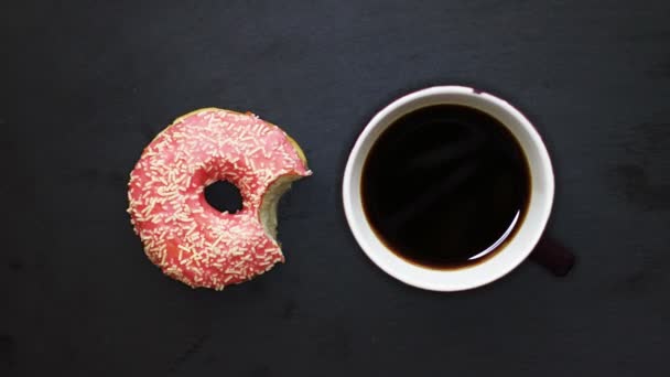 Eating Pink Donut Drinking Cup Coffee Dark Background View Stop — Stock Video