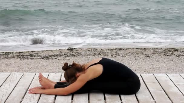 Young Woman Doing Yoga Seaside — Stock Video