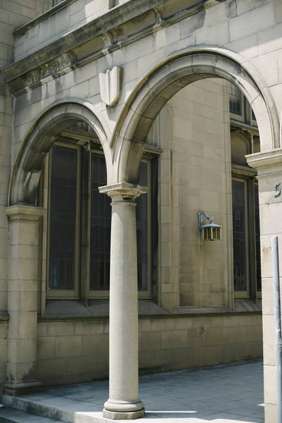 Entry way to old church featuring stone arches