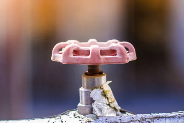 Rusty gate valve of water heater pipe, Texture of rust with blur background.