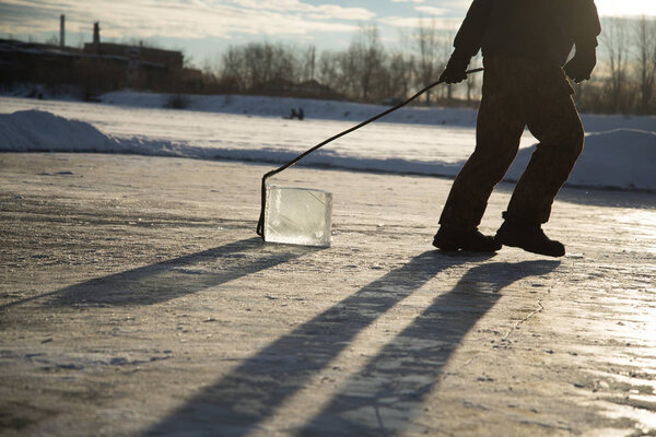 workers mine large cubes of natural river ice 'Ice Miners'