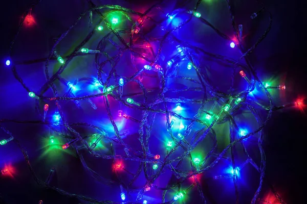 Karácsonyi többszínű fények. Villanyvilágítás. Dekoratív girland — Stock Fotó