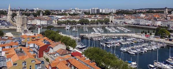 Panoramic high level view of the port of La Rochelle on the coast of the Poitou-Charentes region of France. The tower on the left is the Tour de la Chaine and dates from the 11th century.