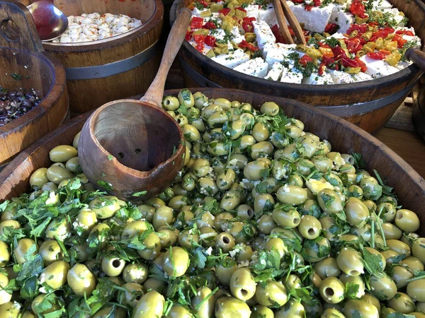 Big tub of olives on a market stall — Stock Photo, Image