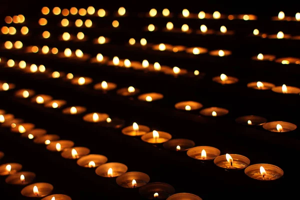 Rows Burning Candles Stock Picture