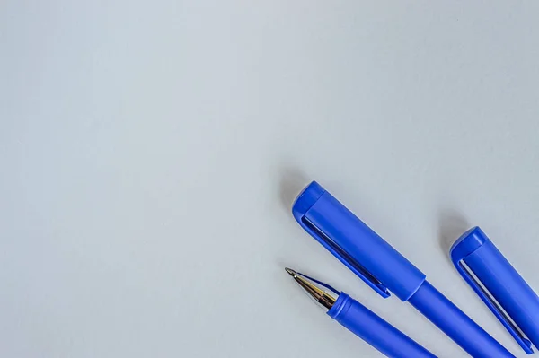 blue pens for writing on a white background isolate