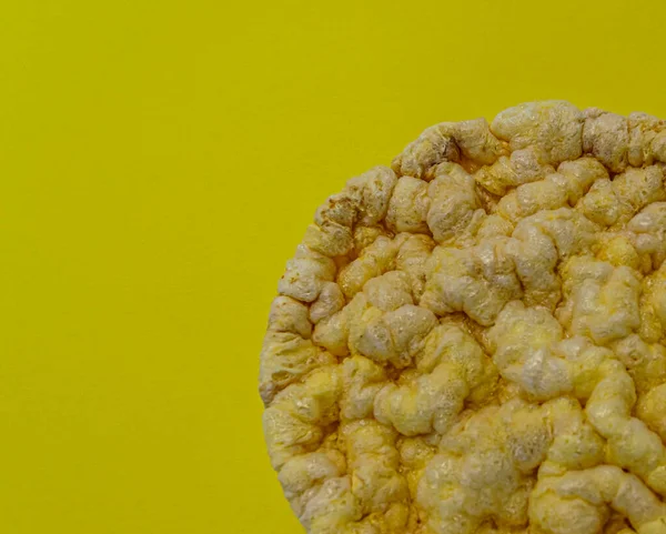 fitness corn crisps on yellow background