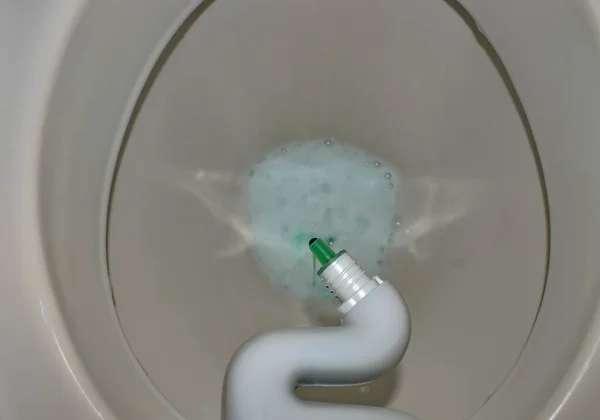 toilet bowl with antibacterial gel with foam close up