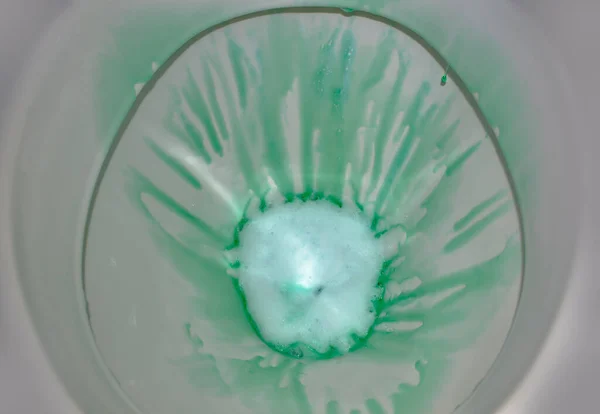 toilet bowl with antibacterial gel with foam close up