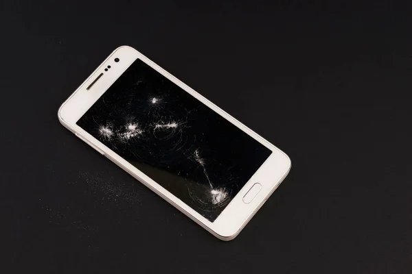 Cellphone with damaged screen.