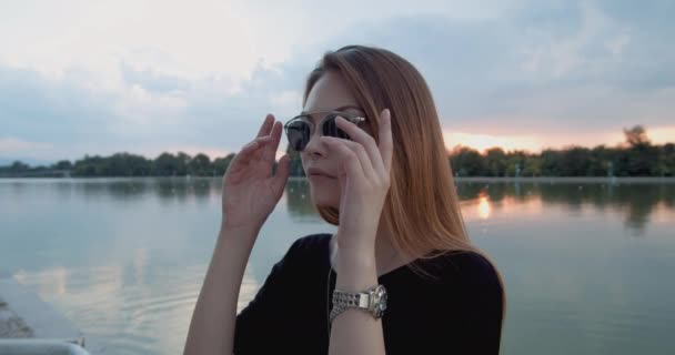 Stylish Young Girl Takes Her Sunglasses Sunset — Stock Video