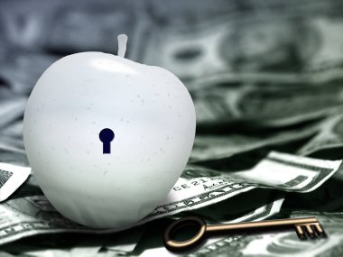 Beyaz elma ile anahtar deliği ve anahtar. Bize dolar.