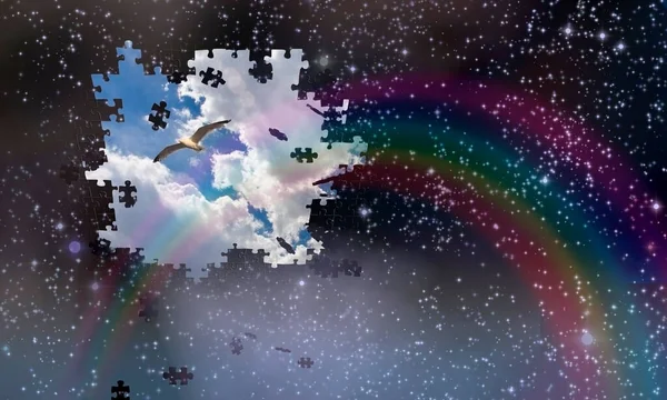 Puzzle pieces fall from night sky revealing day with rainbow — Stock Photo, Image