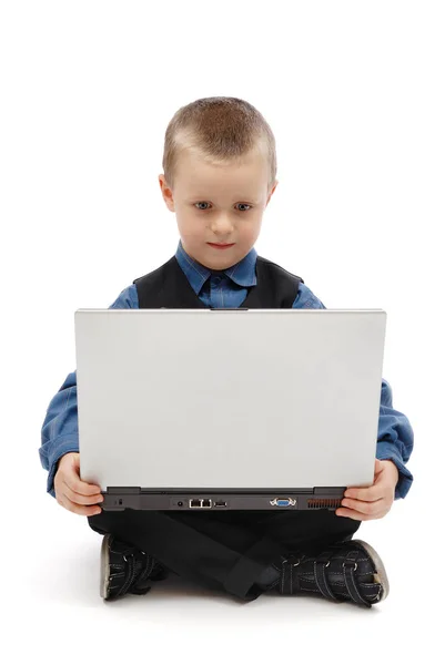 Little boy with a laptop Stock Image