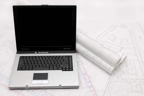 Laptop with architectural plans — Stock Photo, Image