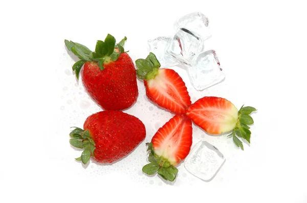 Fresh red strawberries with ice cubes - isolated — Stock Photo, Image