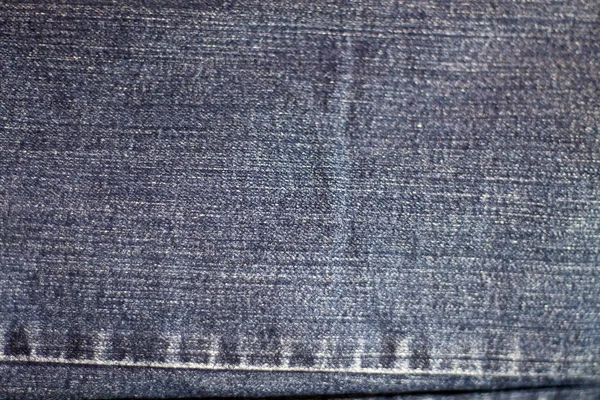 Textur av blå jeans textil närbild — Stockfoto