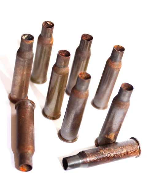 A pile bullet shells on a white background — Stock Photo, Image