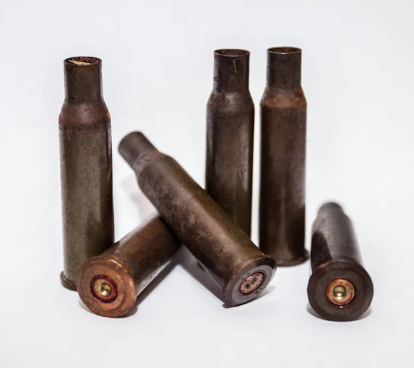 A pile bullet shells on a white background — Stock Photo, Image