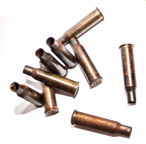 A pile bullet shells on a white background — Stock Photo, Image