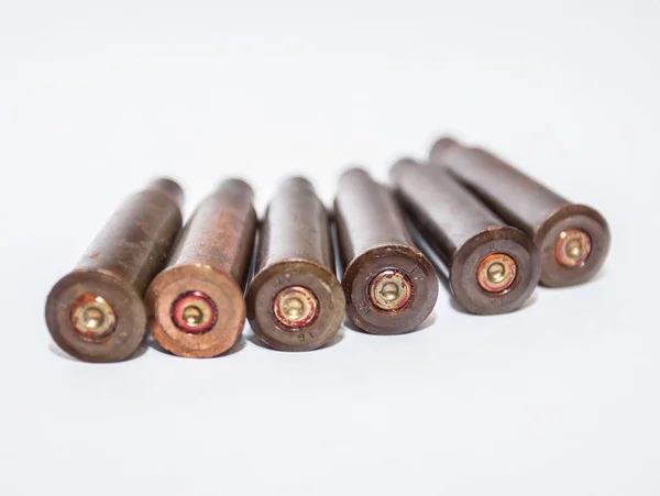 A pile bullet shells on a white background — Stock Photo, Image