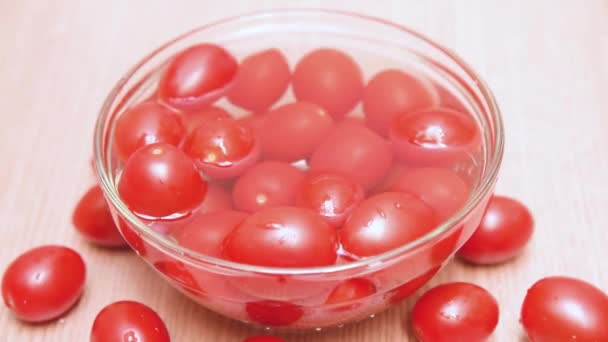 Cherry Tomatoes Falling Bowl Water Other Cherry Tomatoes Wooden Table — Stock Video