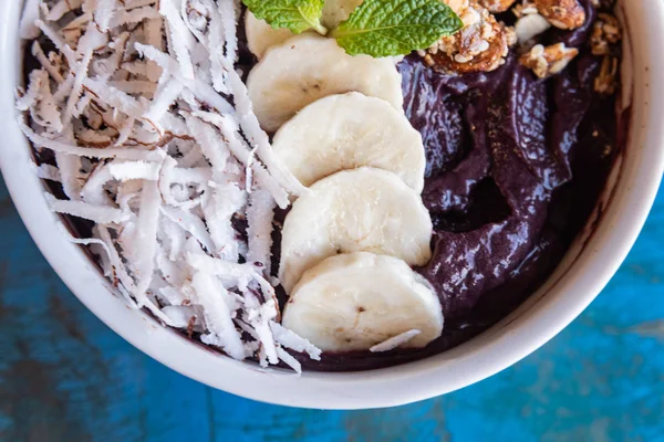 Acai in the bowl with coconut banana mint and other ingredient — Stock Photo, Image