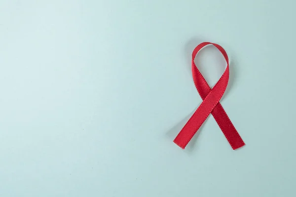 Red ribbon on green background